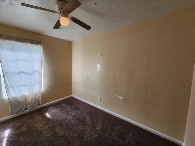 an empty room with a empty space and a window