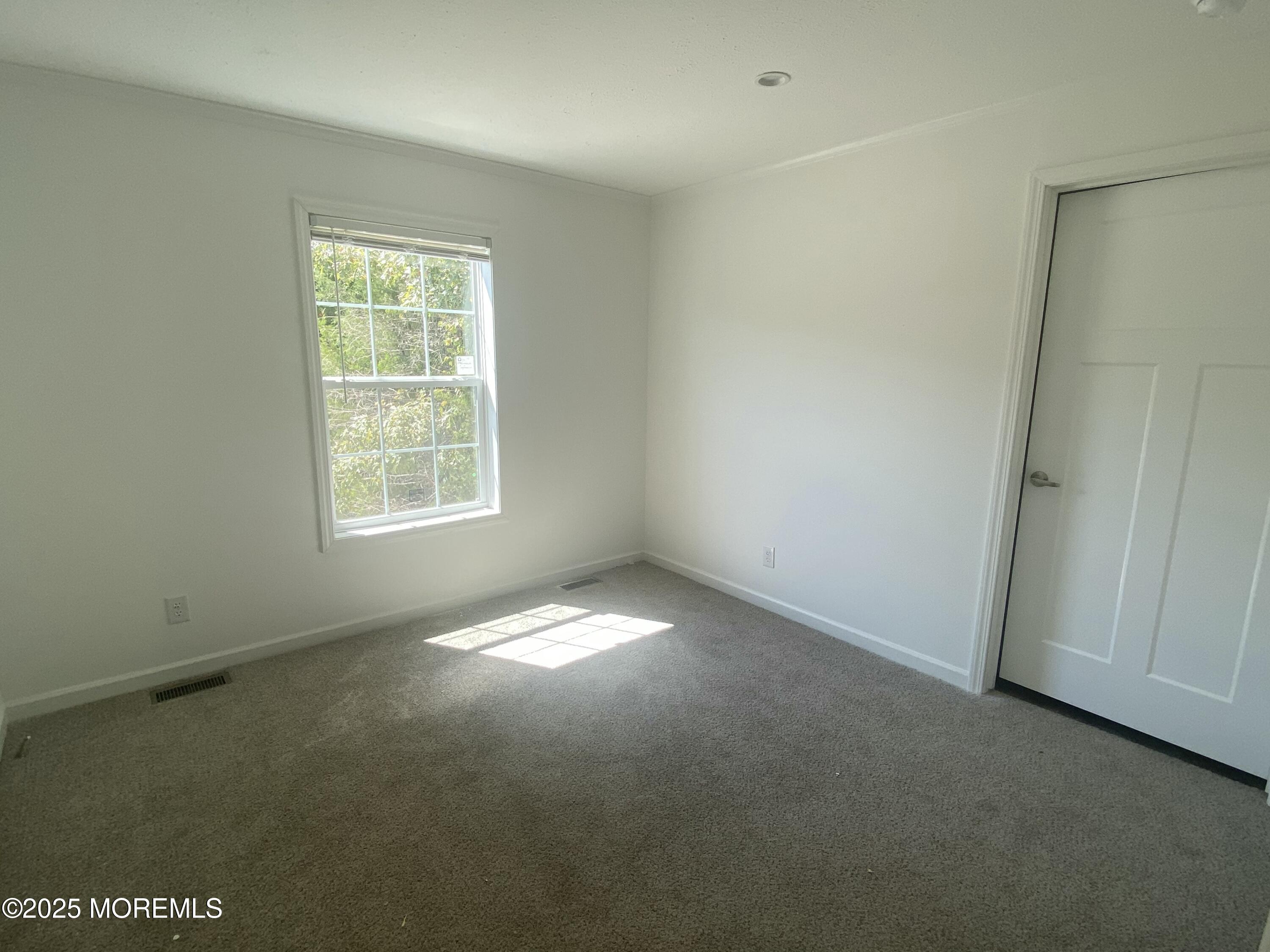 18 Maple Tree Court Manahawkin, NJ 08050 - Photo 11 of 21 an empty room with a window