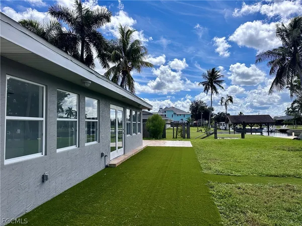 a view of a house with a big yard