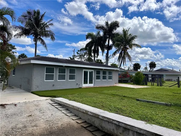 front view of a house with a yard