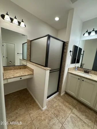 a view of a bathroom with a sink a toilet and a mirror