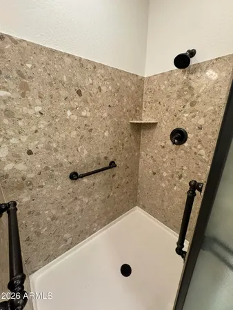 a bathroom with a sink toilet and a mirror