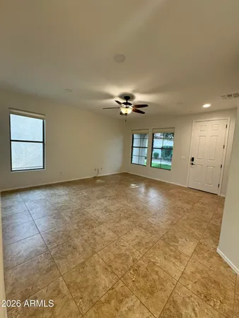 an empty room with a empty space and windows