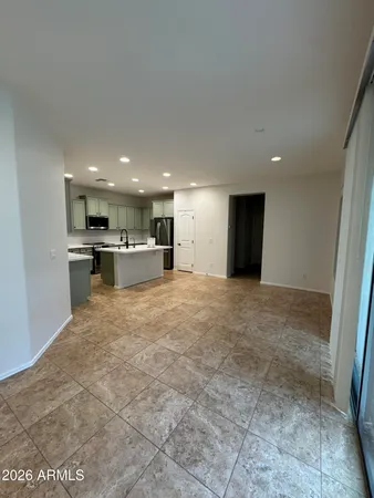 a view of kitchen with refrigerator sink and stove