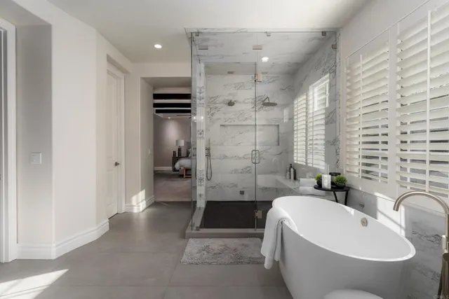 a bathroom with a bathtub and a sink