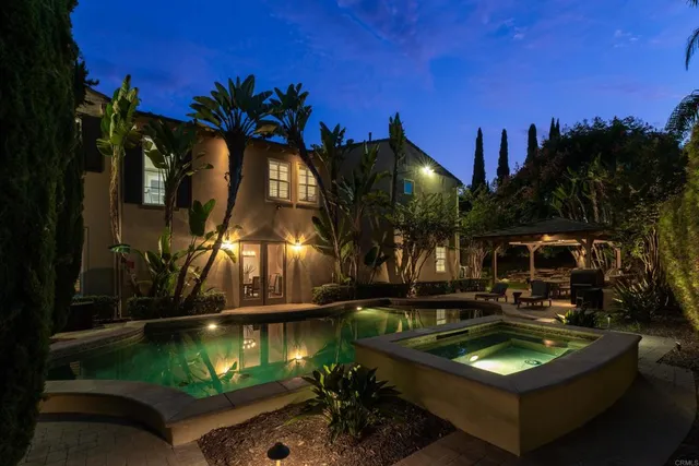 a view of a house with backyard and porch
