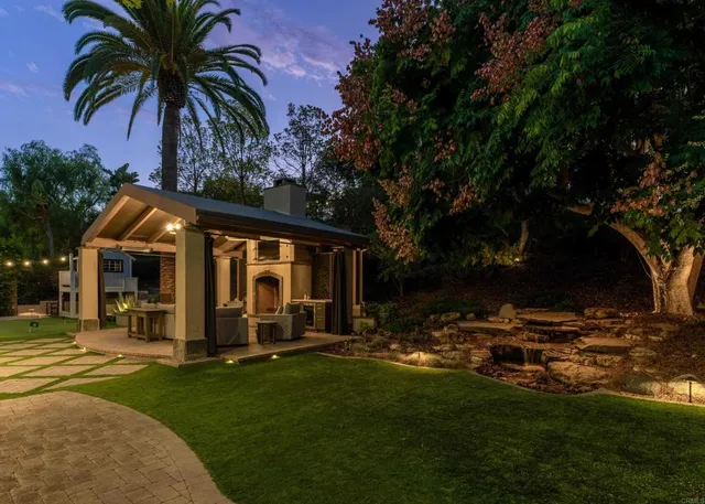 a view of a house with swimming pool and porch