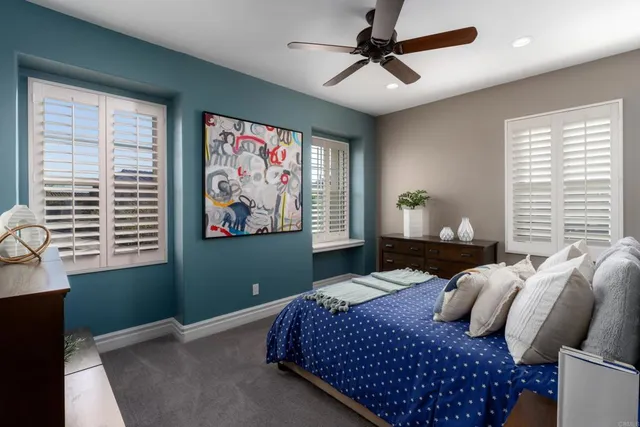 a bedroom with a bed and a table