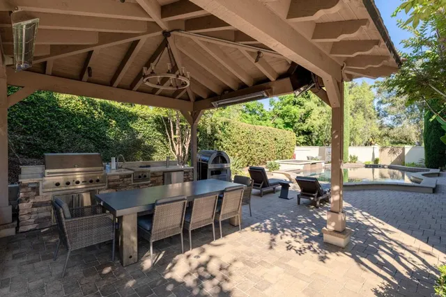 a view of a swimming pool with a patio