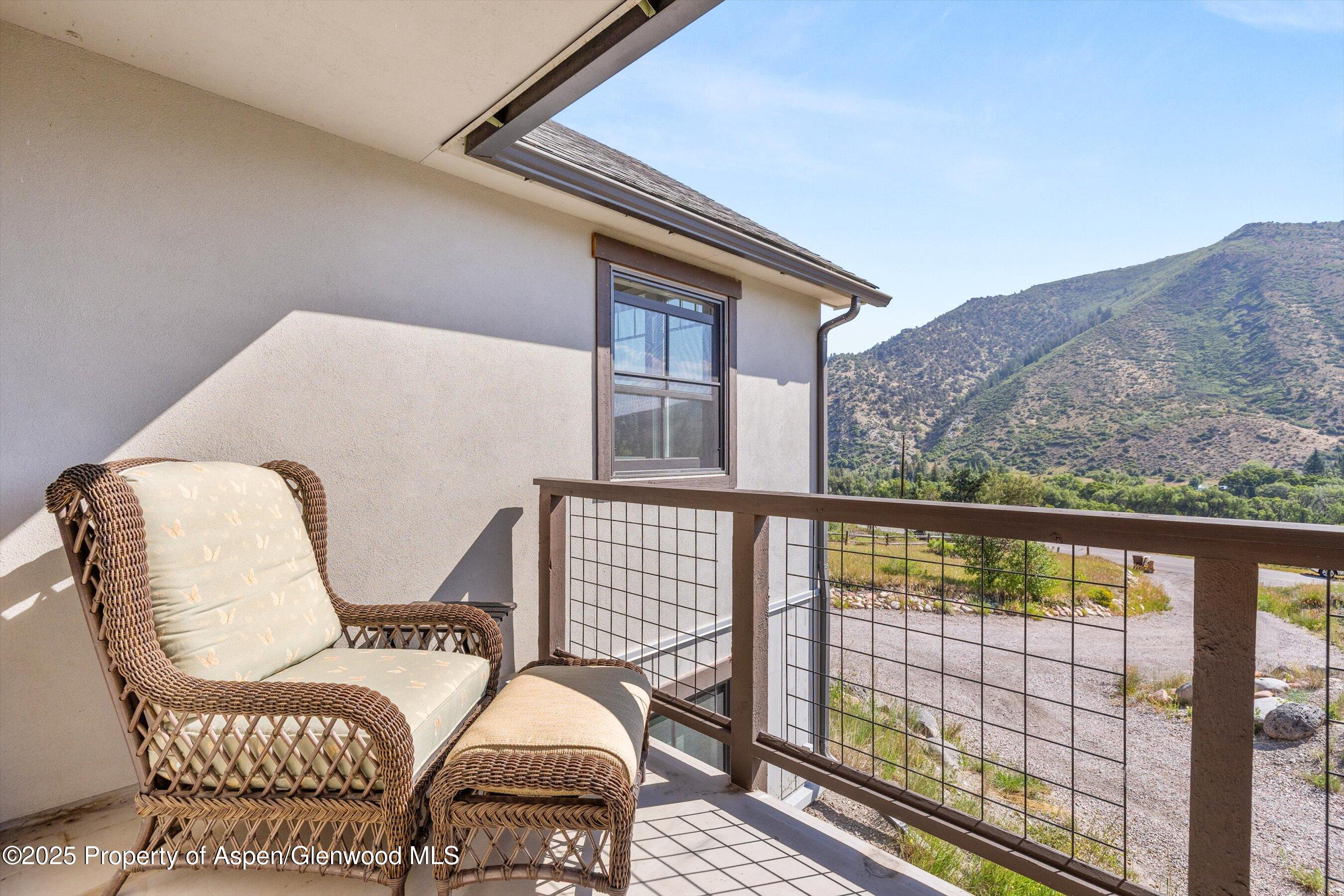 148 Gateway Road Snowmass, CO 81654 - Photo 21 of 32 a balcony view with two chairs and a table