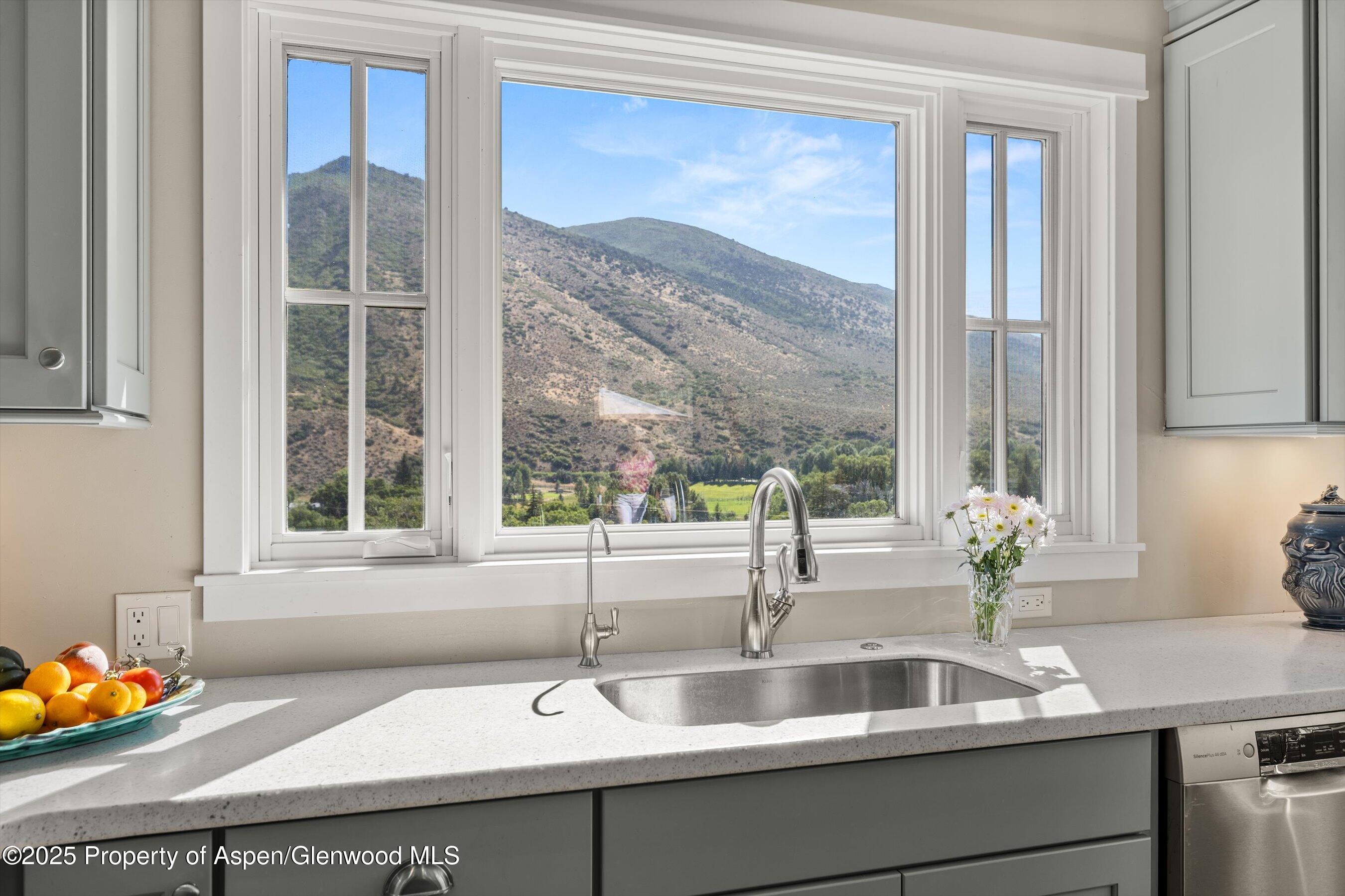 148 Gateway Road Snowmass, CO 81654 - Photo 4 of 32 a sink with a granite countertop and window
