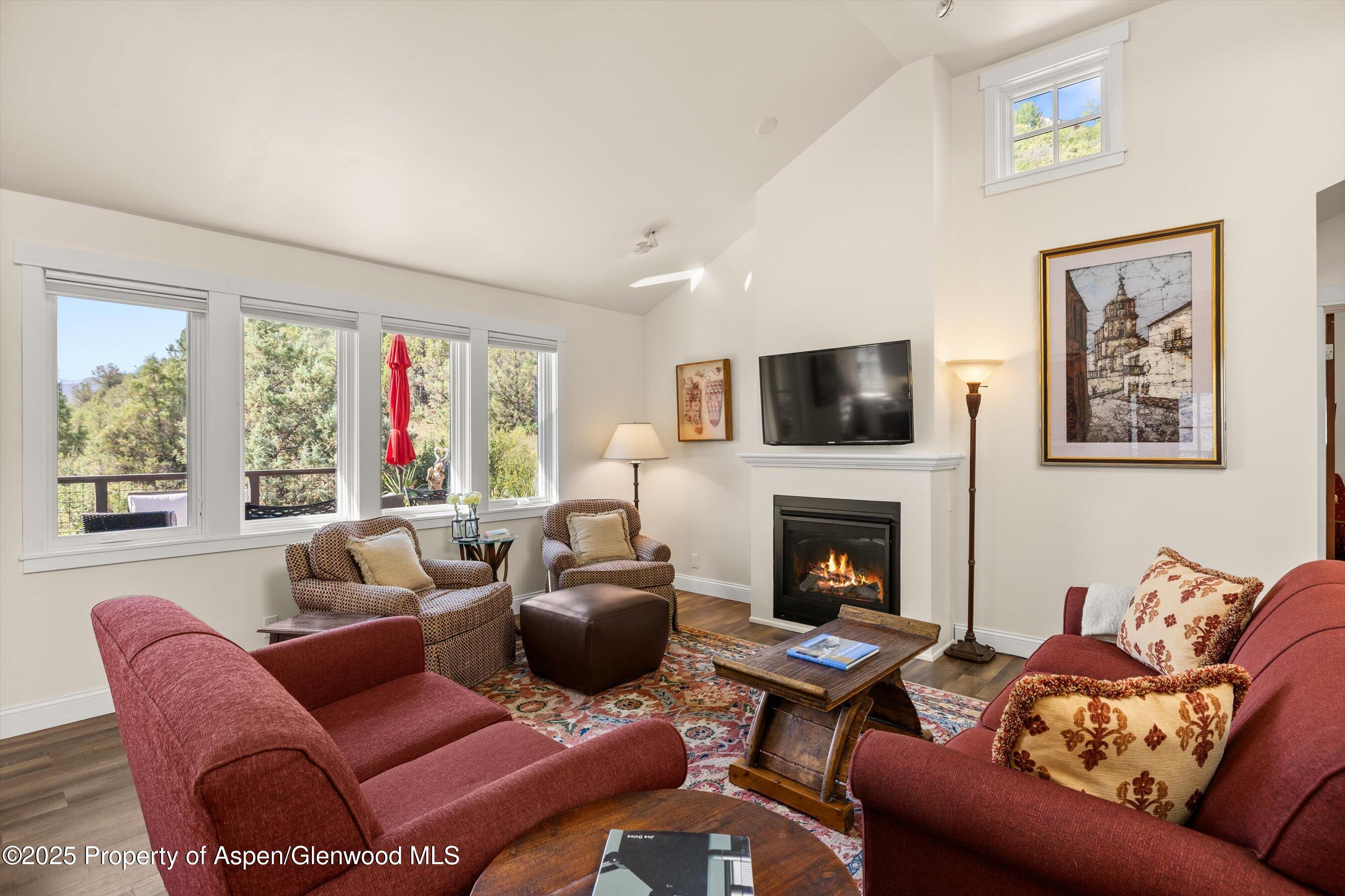 148 Gateway Road Snowmass, CO 81654 - Photo 7 of 32 a living room with furniture fireplace and window
