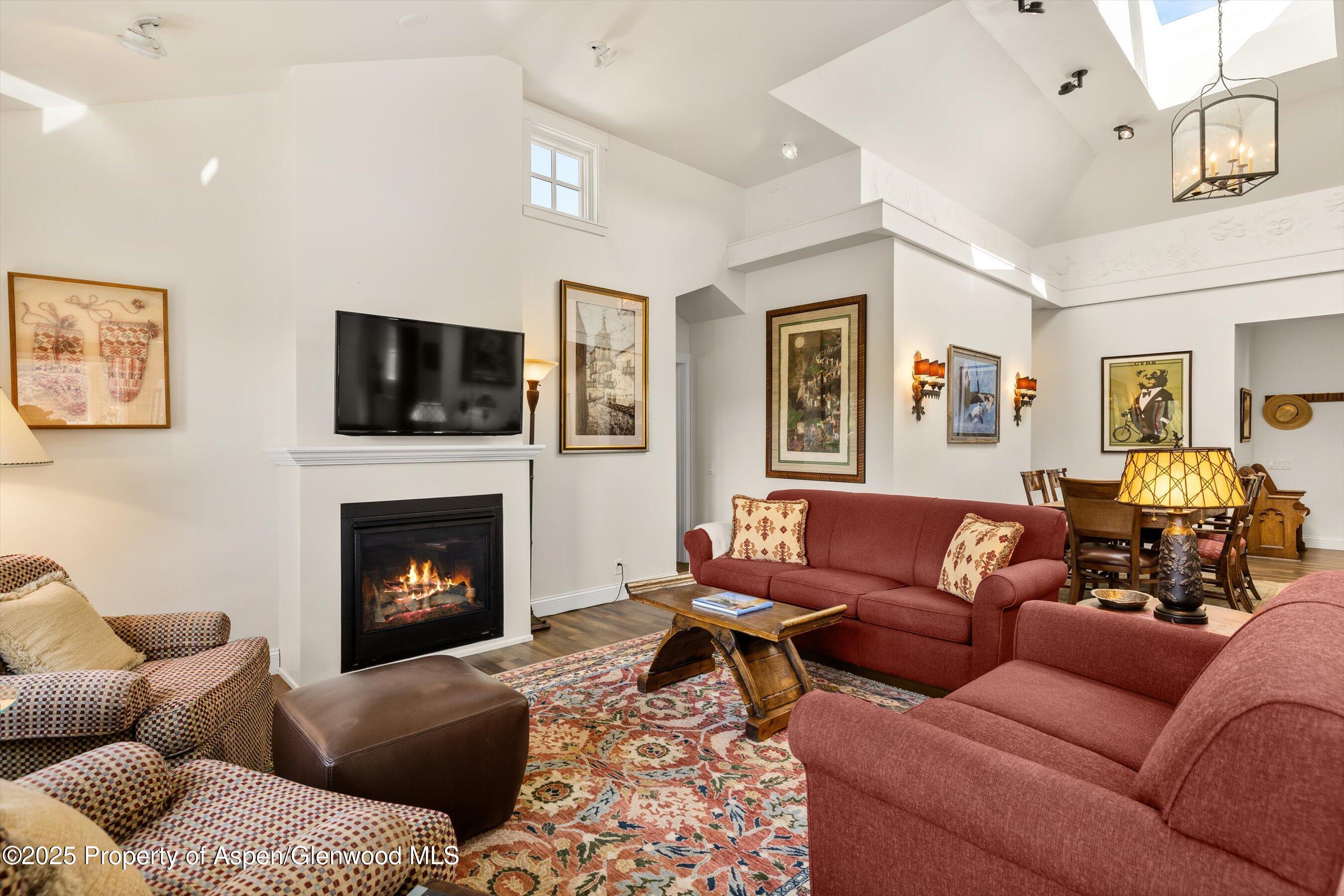 148 Gateway Road Snowmass, CO 81654 - Photo 8 of 32 a living room with furniture fireplace and a flat screen tv