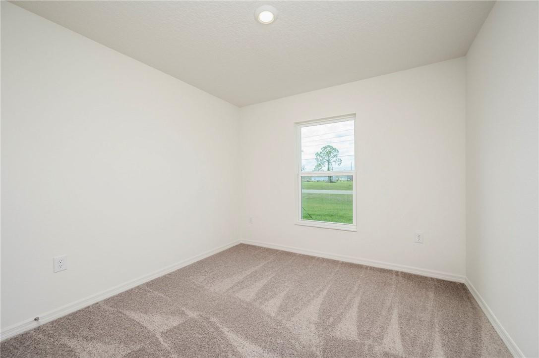 5600 Imagination Drive Fort Pierce, FL 34947 - Photo 18 of 21 an empty room with a window