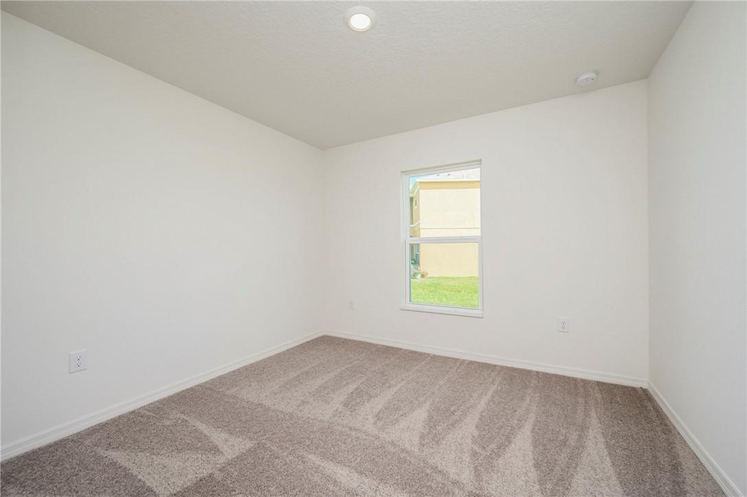 5600 Imagination Drive Fort Pierce, FL 34947 - Photo 19 of 21 an empty room with a window