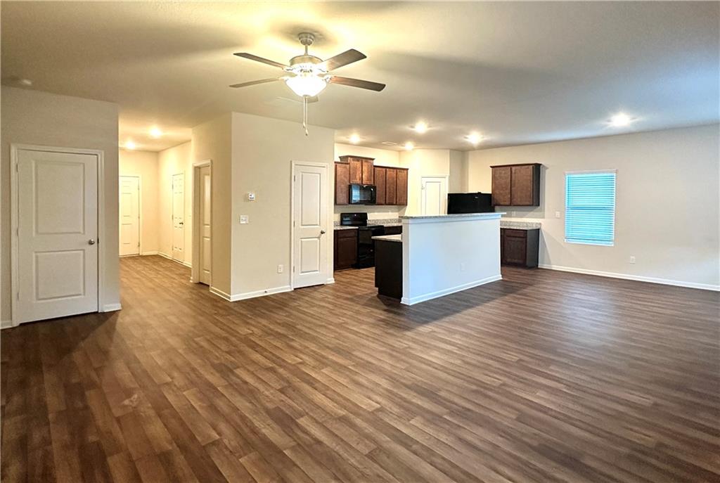 916 Independence Avenue Pendergrass, GA 30567 - Photo 14 of 30 a view of kitchen with wooden floor and electronic appliances