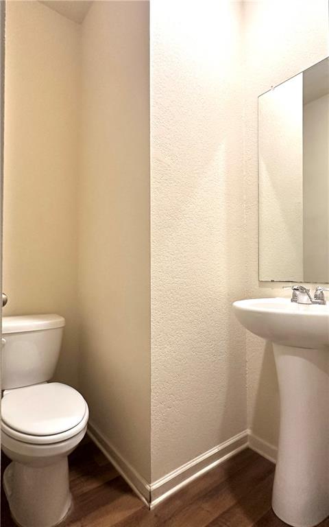 916 Independence Avenue Pendergrass, GA 30567 - Photo 16 of 30 a bathroom with a sink and a toilet