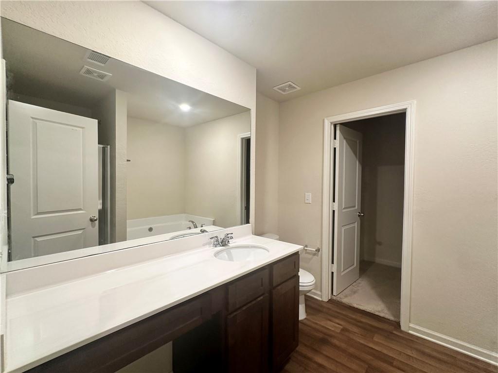 916 Independence Avenue Pendergrass, GA 30567 - Photo 21 of 30 a bathroom with a double vanity sink and mirror