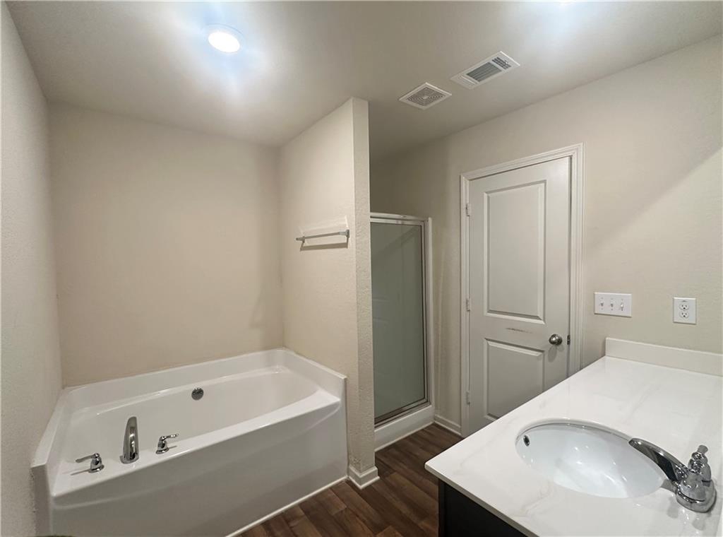 916 Independence Avenue Pendergrass, GA 30567 - Photo 22 of 30 a bathroom with a tub sink and mirror