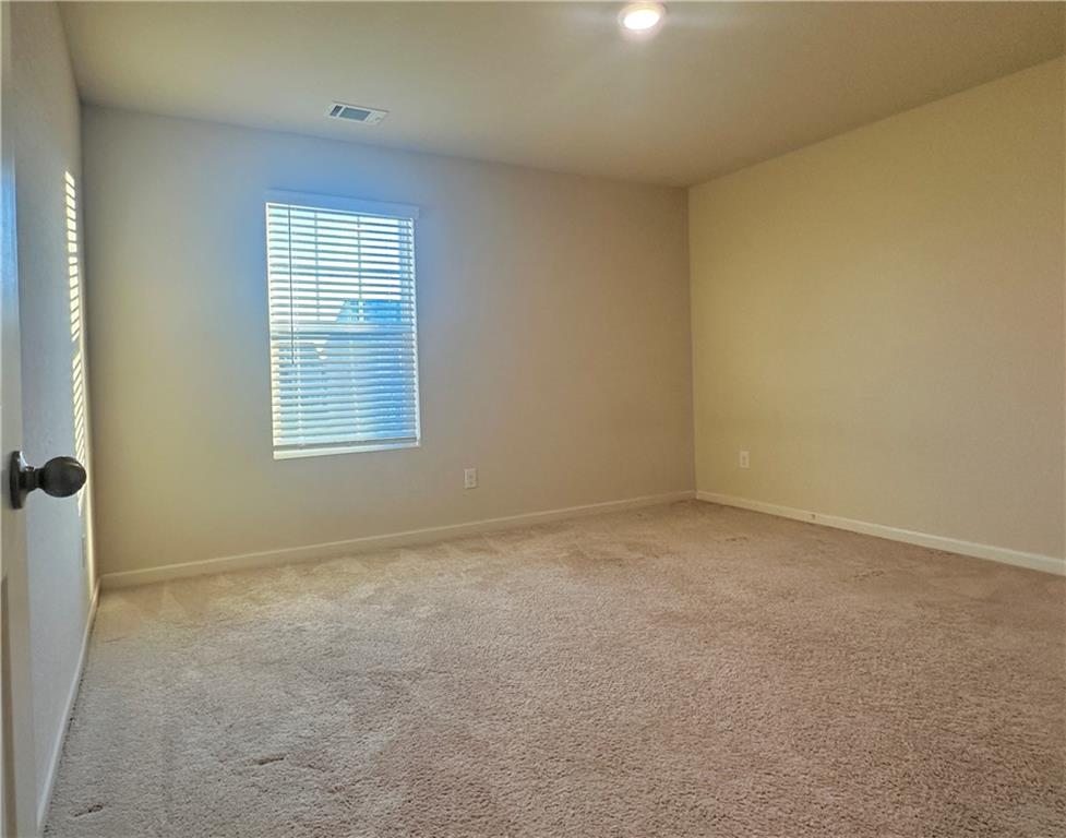 916 Independence Avenue Pendergrass, GA 30567 - Photo 27 of 30 an empty room with windows