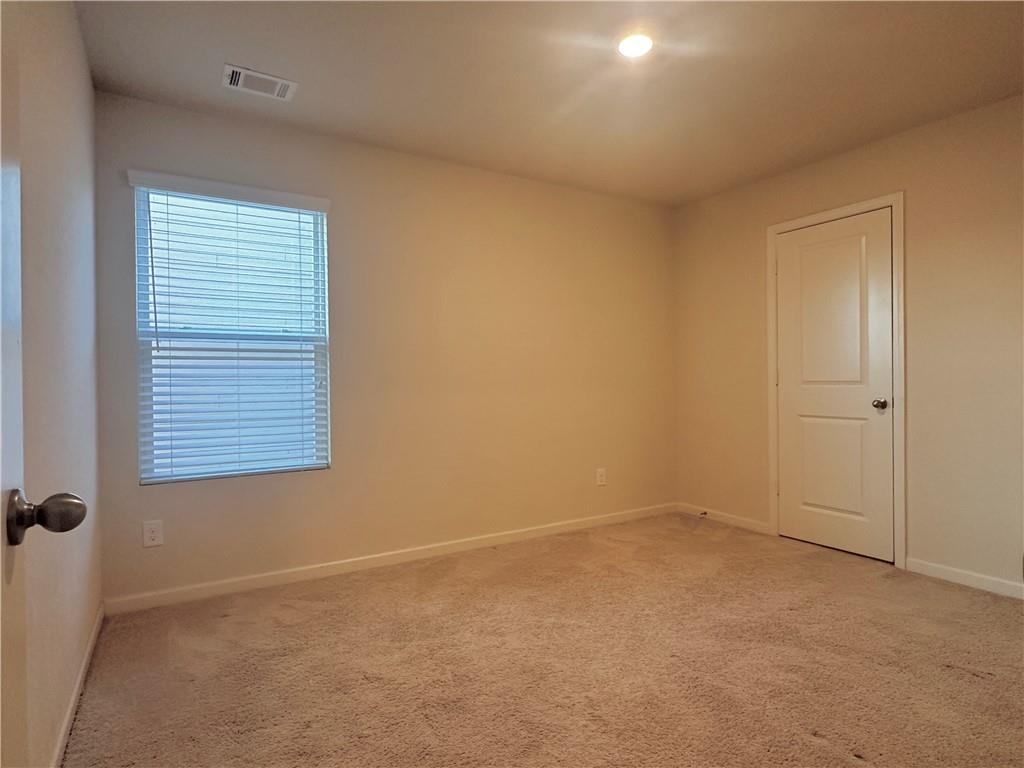 916 Independence Avenue Pendergrass, GA 30567 - Photo 29 of 30 an empty room with a window