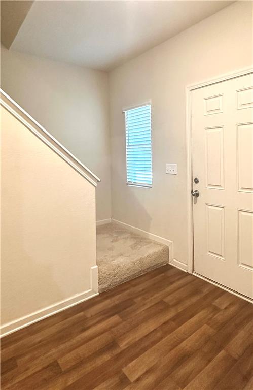 916 Independence Avenue Pendergrass, GA 30567 - Photo 4 of 30 an empty room with wooden floor and windows
