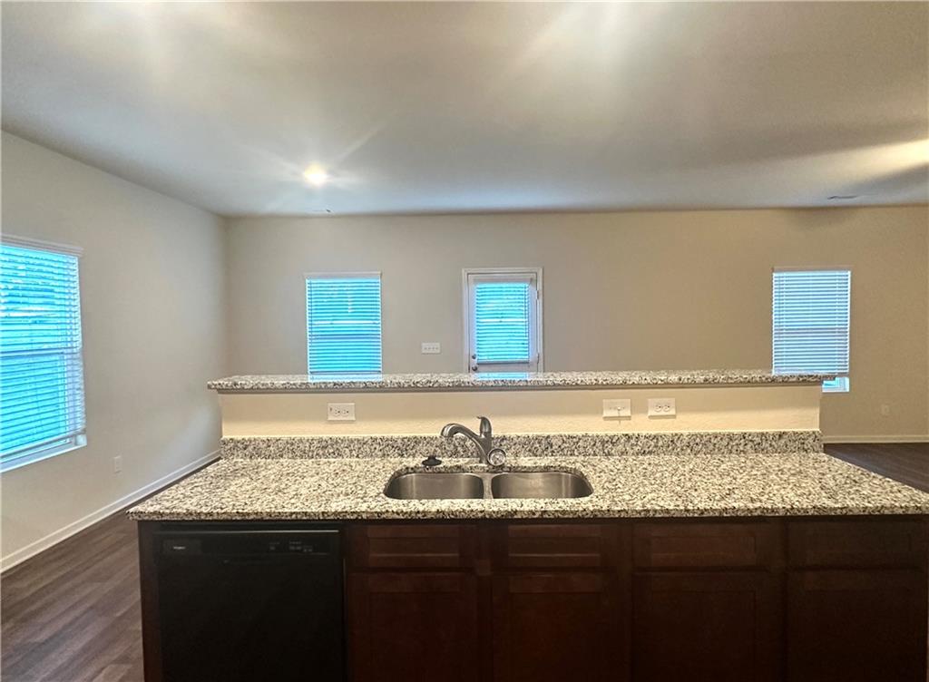 916 Independence Avenue Pendergrass, GA 30567 - Photo 10 of 30 a bathroom with a granite countertop sink and a large mirror