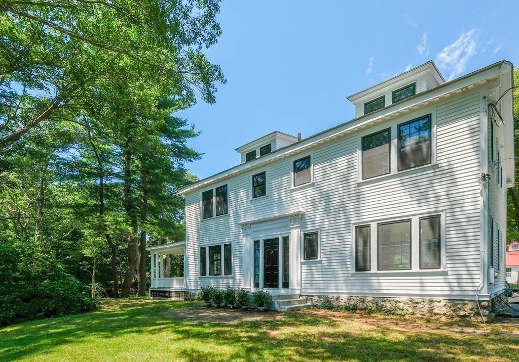270 Concord Road Wayland, MA 01778 - Photo 3 of 9 a front view of a house with a garden