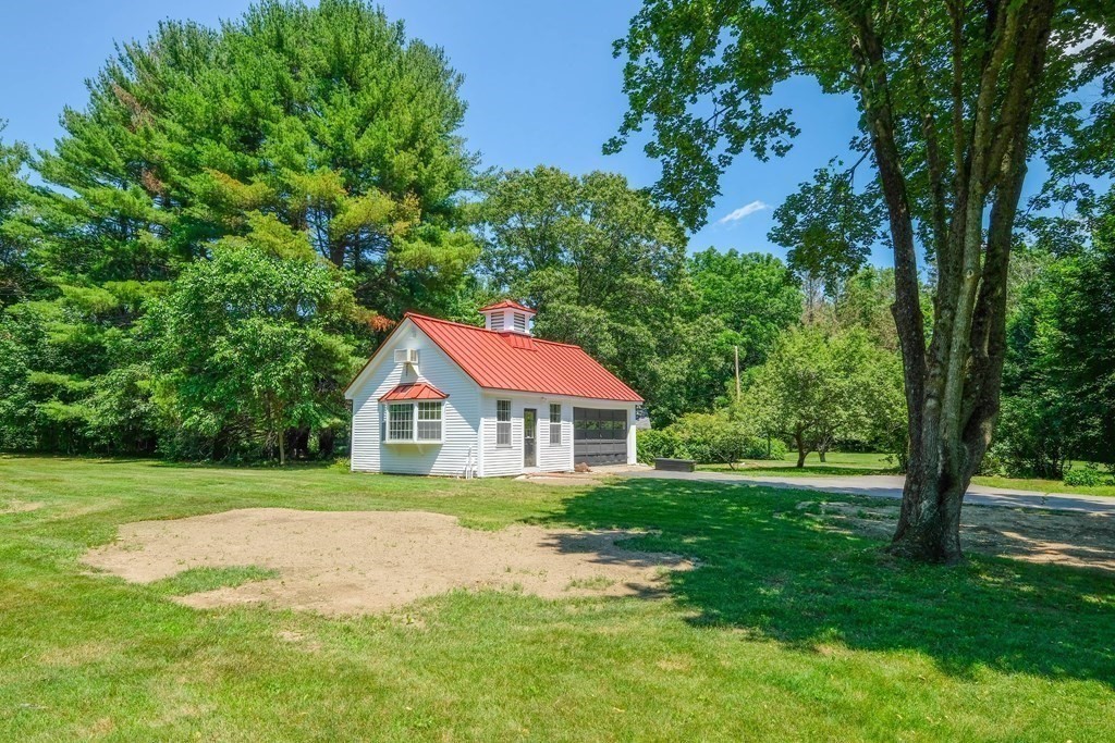 270 Concord Road Wayland, MA 01778 - Photo 8 of 9 a front view of a house with a yard