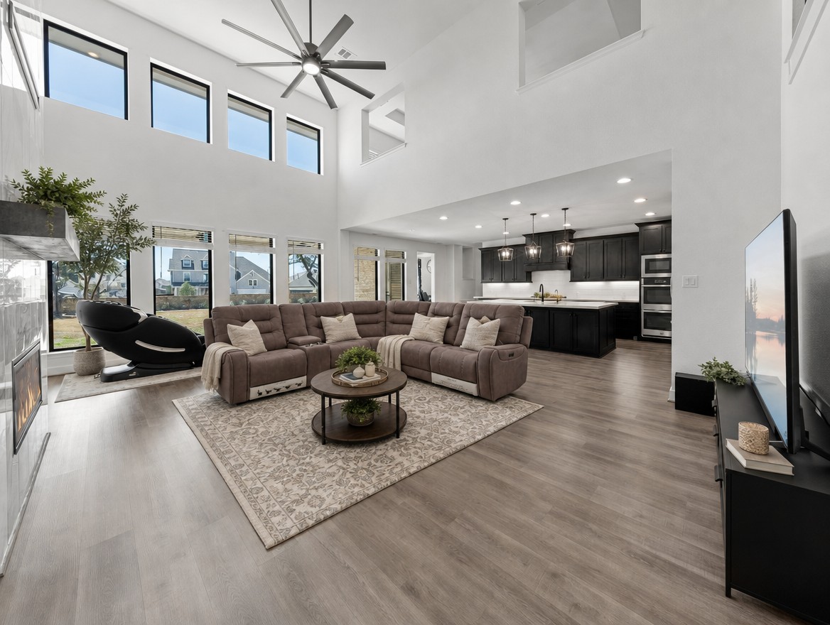 1440 Riva Ridge Drive Leander, TX 78641 - Photo 5 of 37 A grand, open living area showcases tall ceilings and abundant natural light.