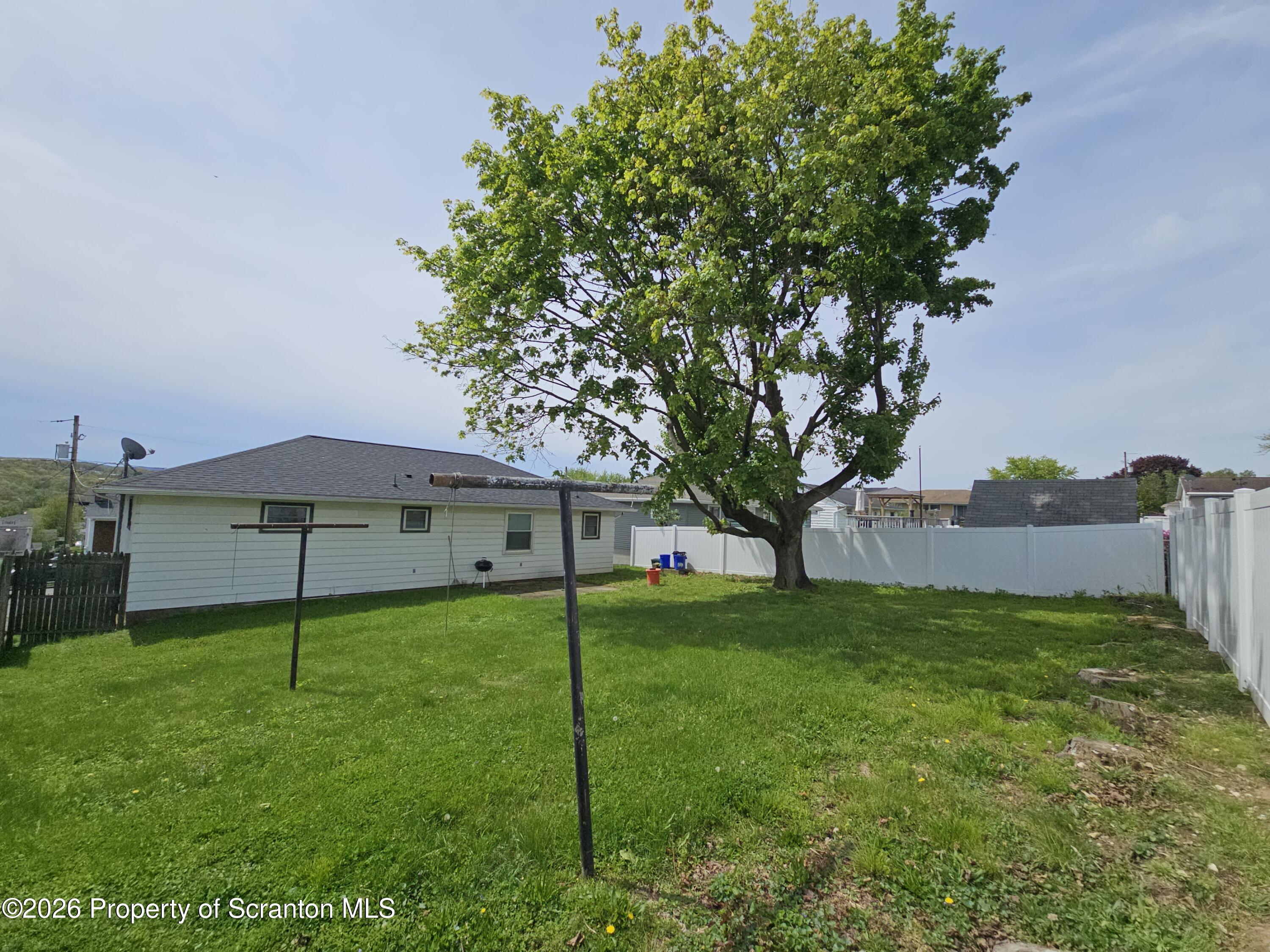 405 Baker Street Taylor, PA 18517 - Photo 7 of 36 a view of a house with backyard