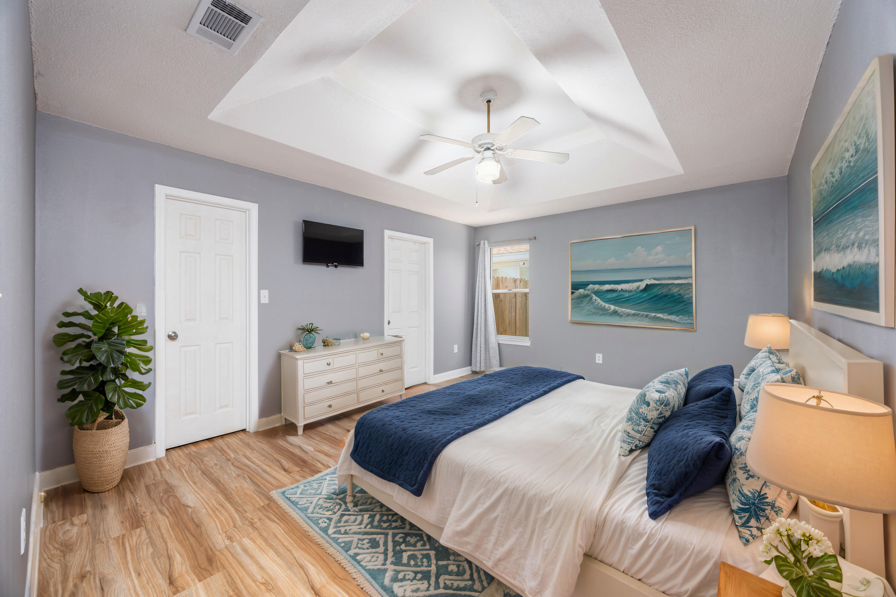 39 Pine Ridge Trace Destin, FL 32541 - Photo 12 of 42 a bedroom with a bed and a chandelier