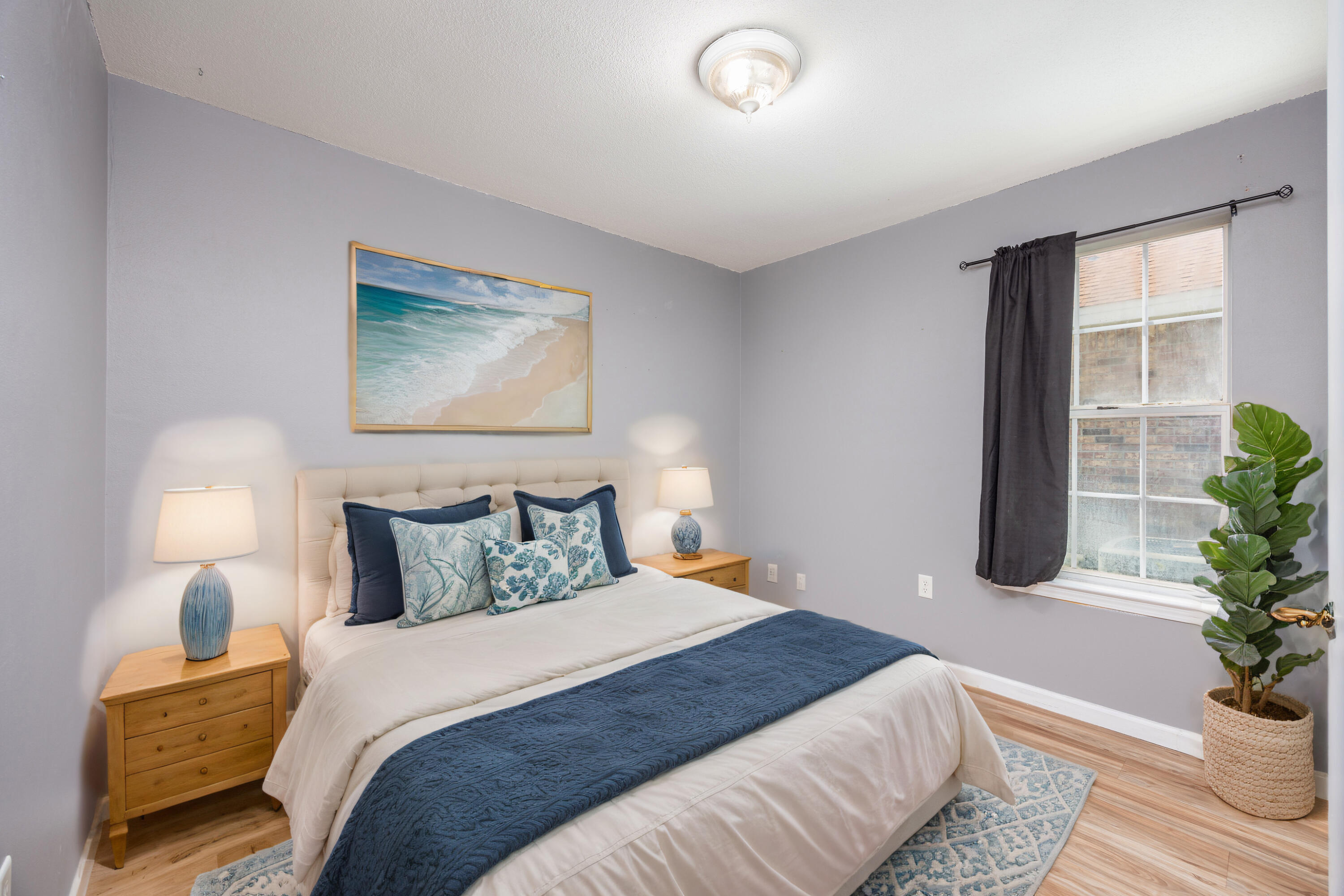 39 Pine Ridge Trace Destin, FL 32541 - Photo 21 of 42 a bedroom with bed and potted plant