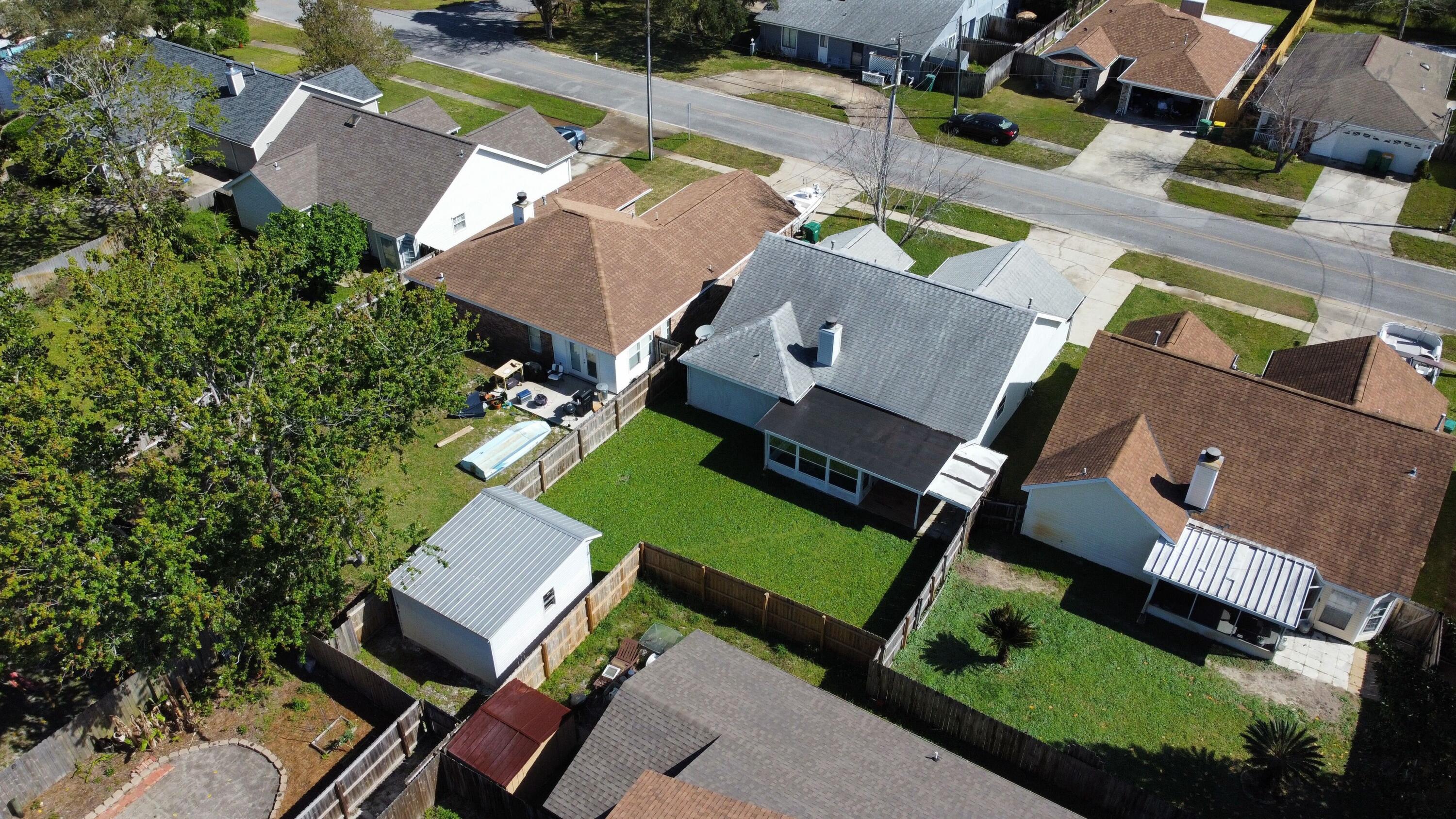 39 Pine Ridge Trace Destin, FL 32541 - Photo 39 of 42 an aerial view of a house with a garden and trees