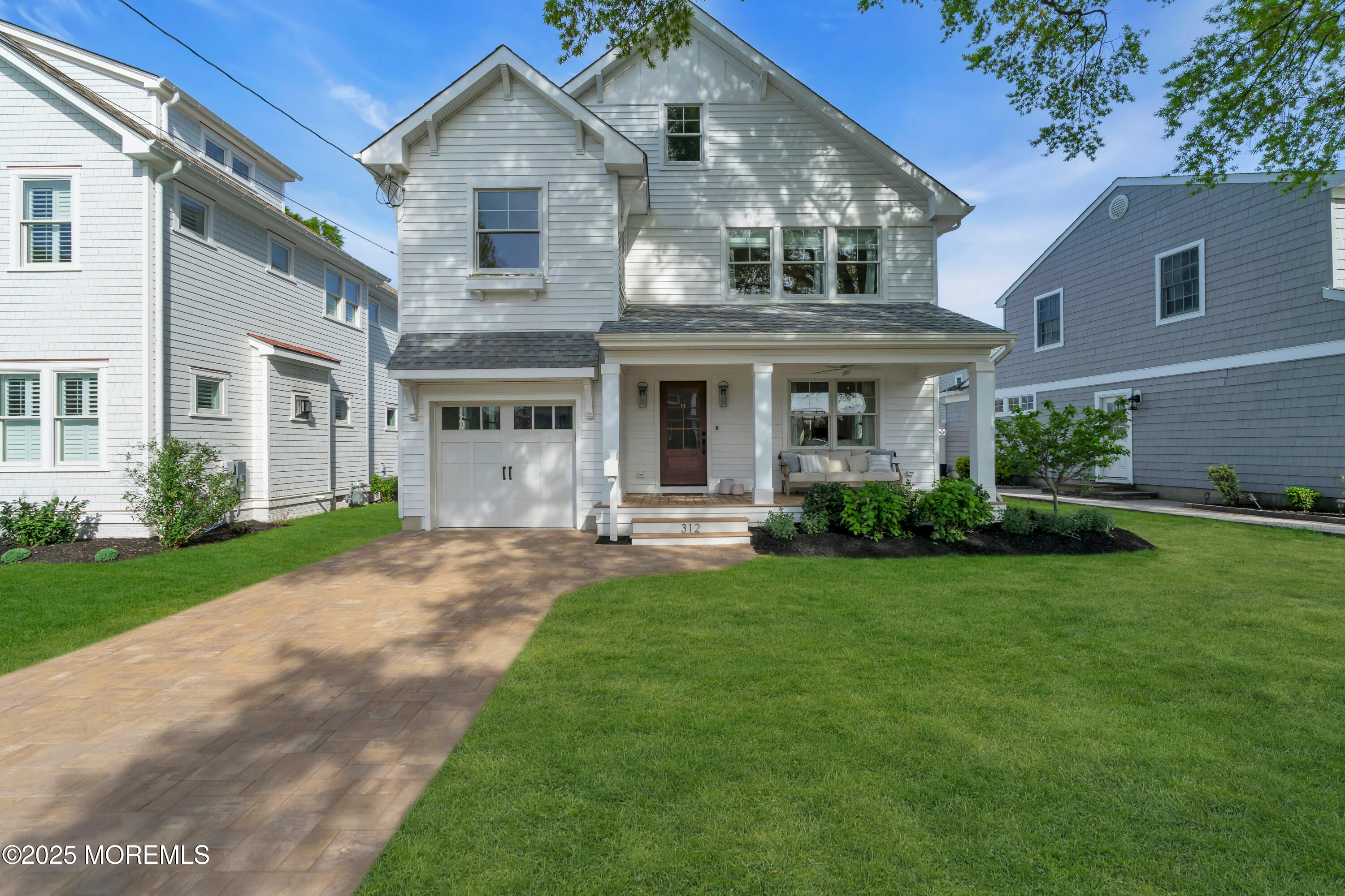 312 Woodland Road Point Pleasant Beach, NJ 08742 - Photo 3 of 52 a front view of a house with a yard