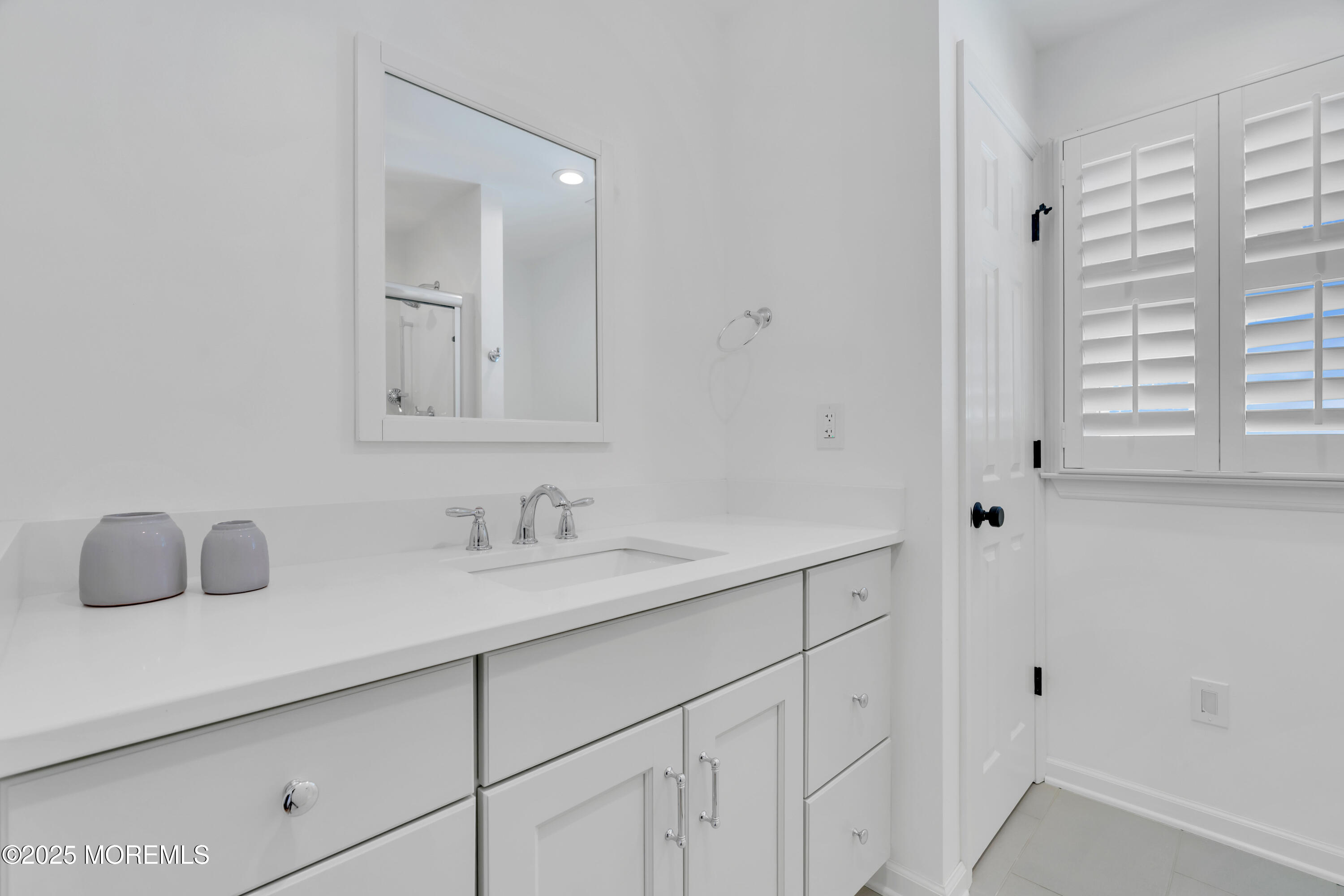 312 Woodland Road Point Pleasant Beach, NJ 08742 - Photo 33 of 52 a bathroom with a sink and a mirror