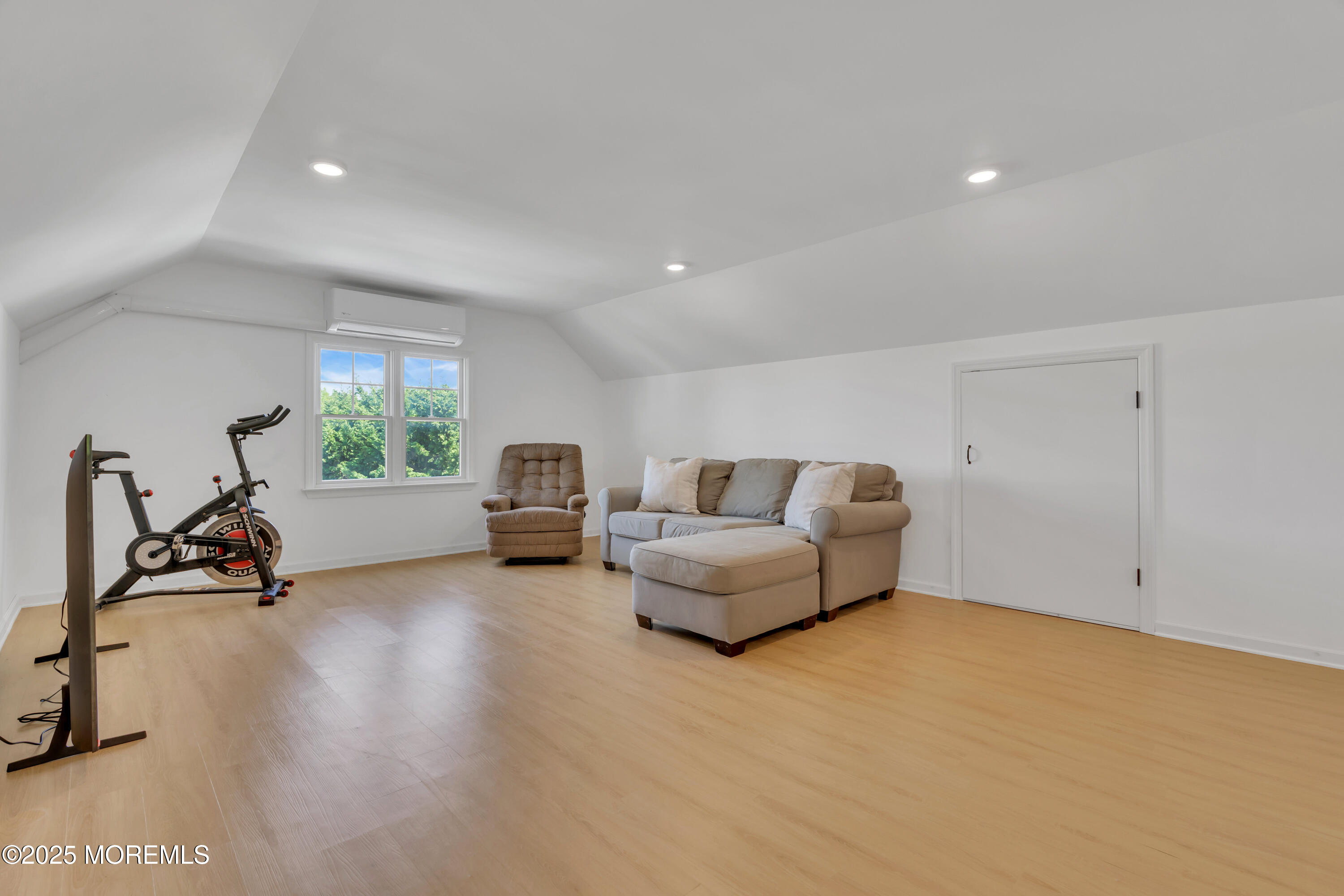 312 Woodland Road Point Pleasant Beach, NJ 08742 - Photo 36 of 52 a living room with furniture a window and gym equipment