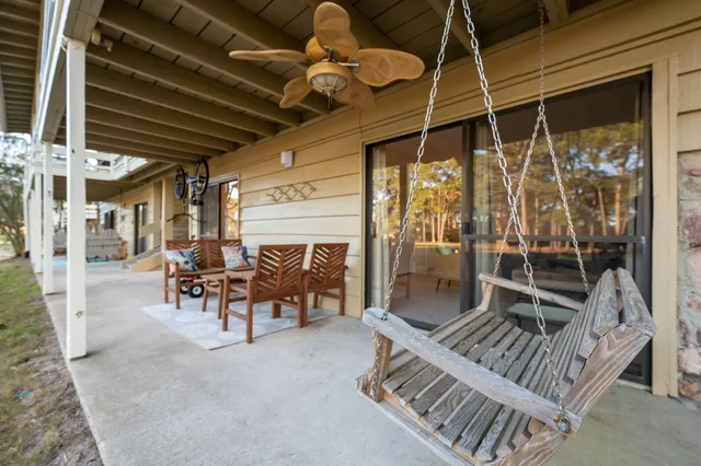 a view of a porch with furniture and a table