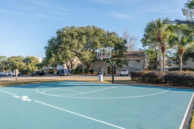 a view of a swimming pool with an outdoor seating