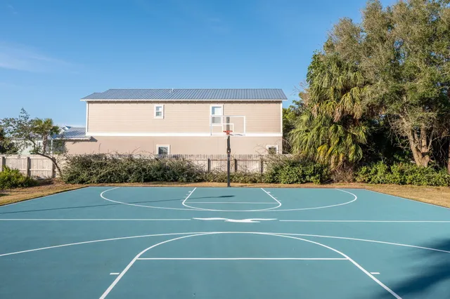 an aerial view of a house with a yard and garden