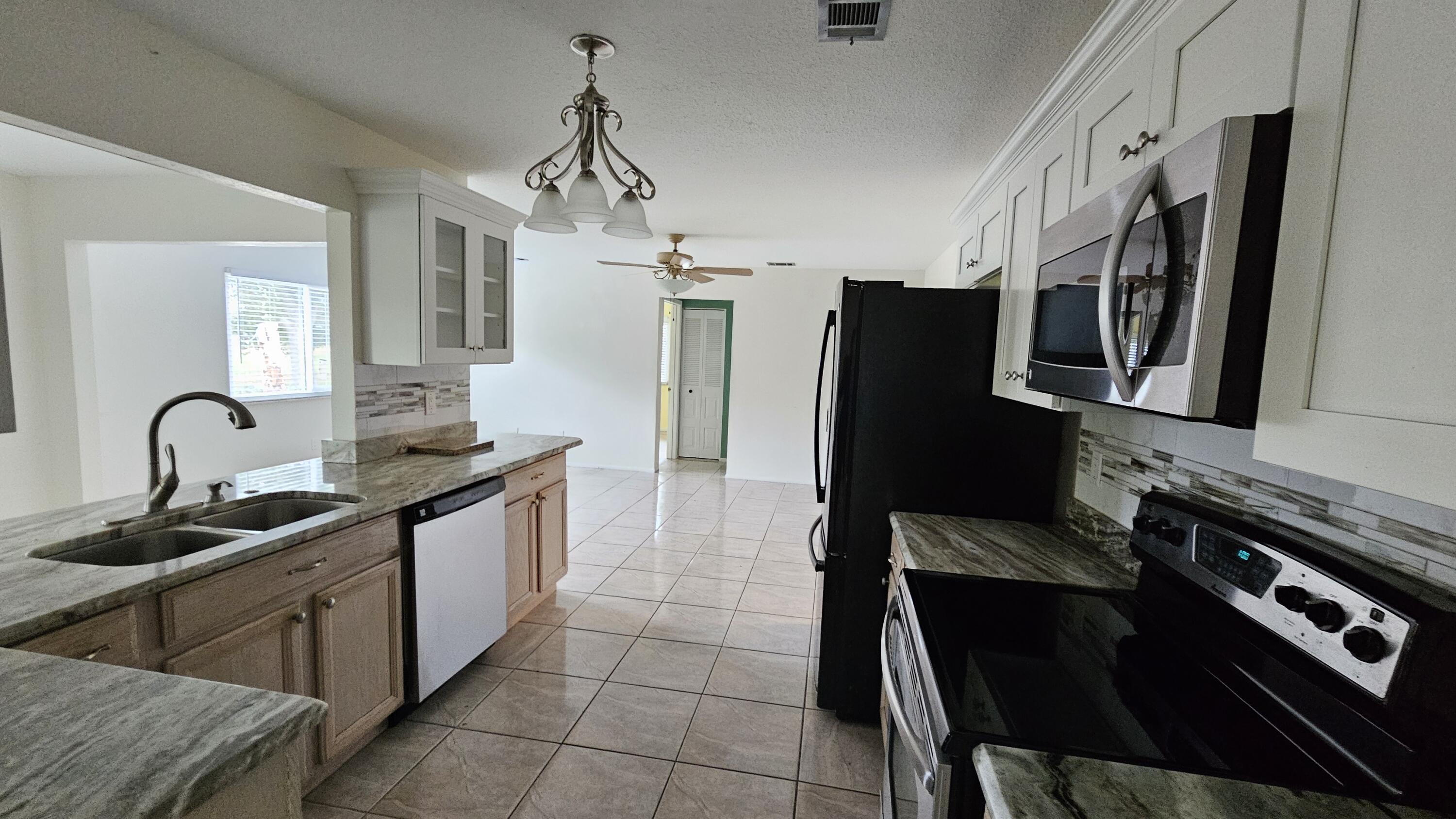 3002 Southeast Dalhart Road Port St. Lucie, FL 34952 - Photo 4 of 10 20260114_120244