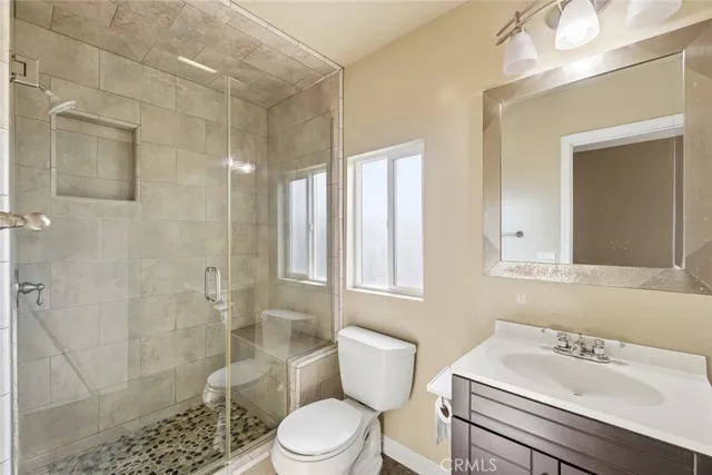 a aerial view of a house with swimming pool next to a yard