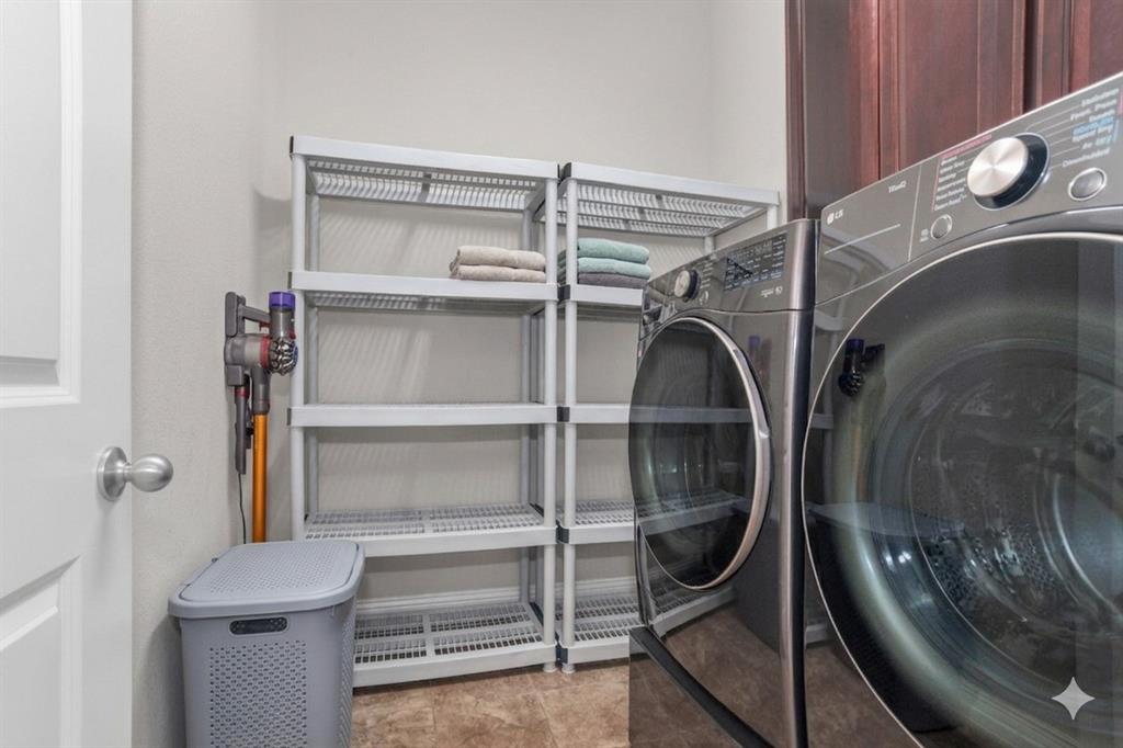 8631 Lohr Valley Road Irving, TX 75063 - Photo 16 of 32 Laundry room featuring separate washer and dryer