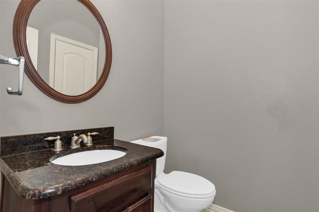 8631 Lohr Valley Road Irving, TX 75063 - Photo 17 of 32 Bathroom featuring vanity and toilet
