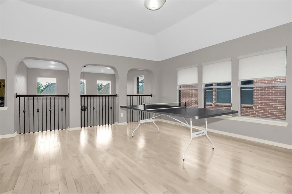 8631 Lohr Valley Road Irving, TX 75063 - Photo 18 of 32 Game room featuring light wood finished floors and baseboards