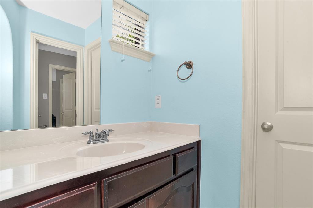 8631 Lohr Valley Road Irving, TX 75063 - Photo 24 of 32 Bathroom featuring vanity