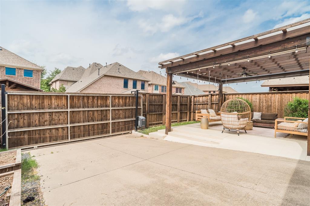 8631 Lohr Valley Road Irving, TX 75063 - Photo 28 of 32 Fenced backyard featuring a patio area, ceiling fan, a residential view, a pergola, and outdoor lounge area