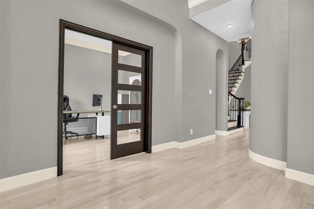 8631 Lohr Valley Road Irving, TX 75063 - Photo 3 of 32 Foyer entrance with light wood-style floors, arched walkways, and french doors