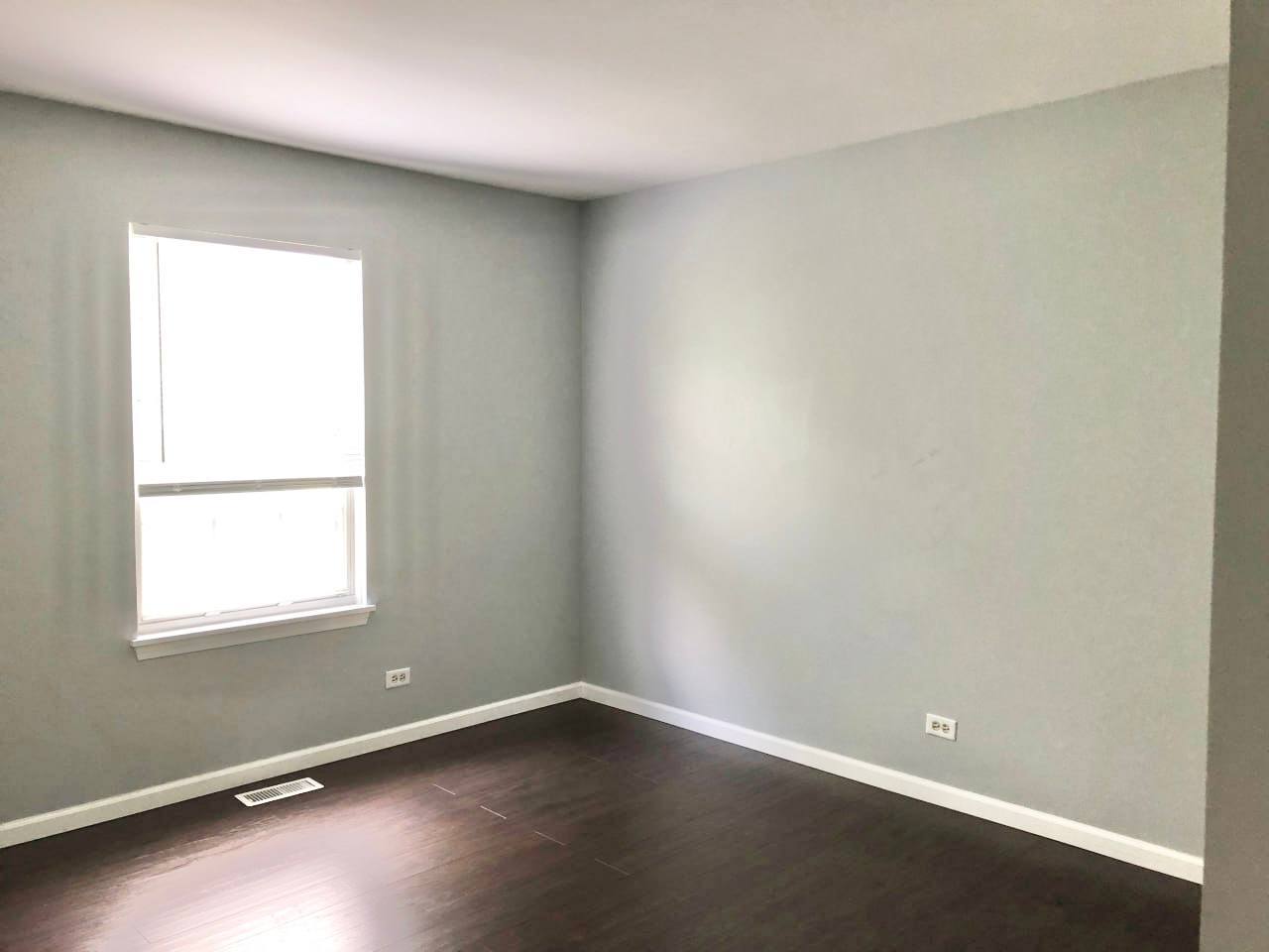 278 Half Moon Circle Aurora, IL 60504 - Photo 13 of 19 an empty room with wooden floor and windows