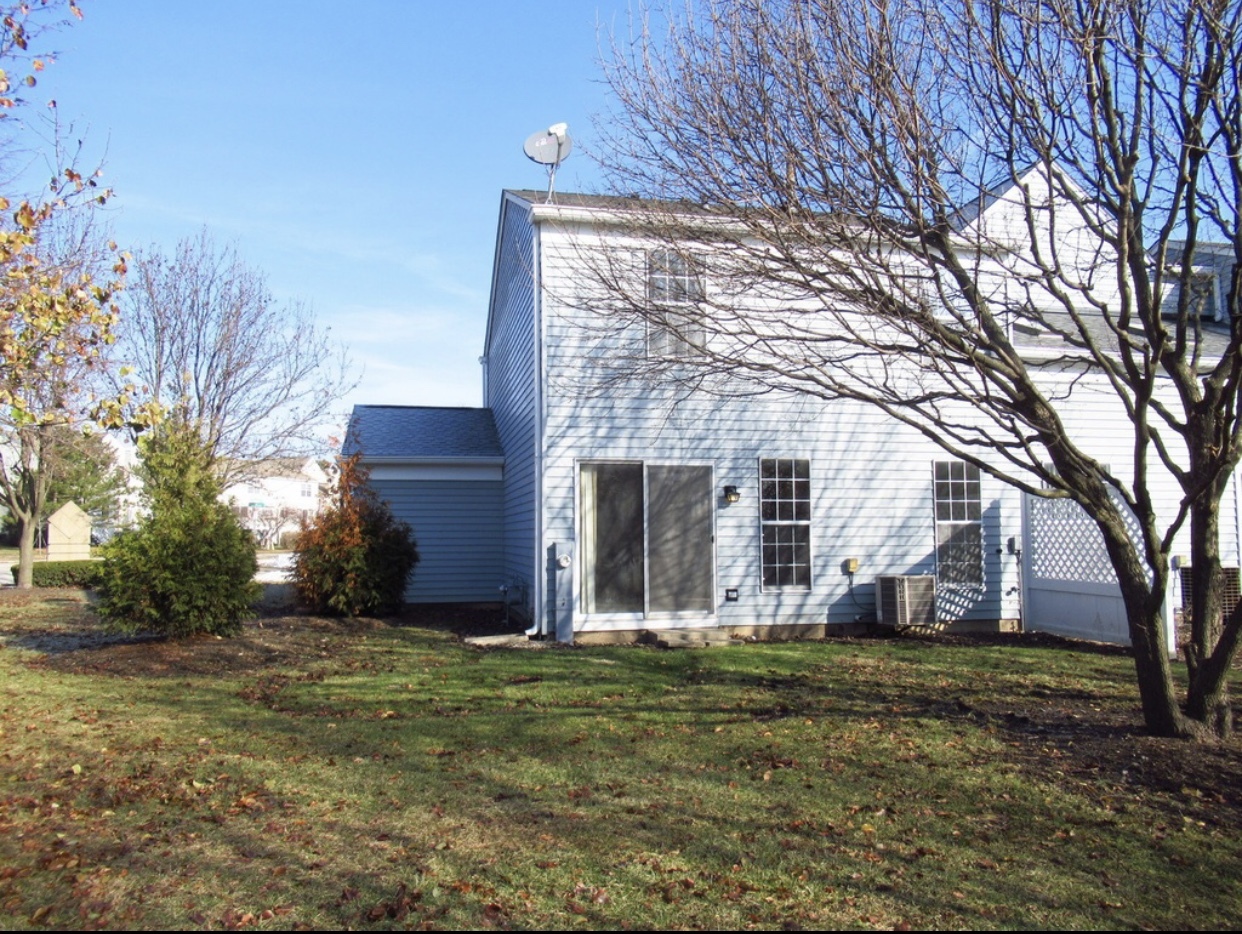 278 Half Moon Circle Aurora, IL 60504 - Photo 18 of 19 a view of a house with a yard